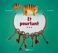 Des clés sont suspendues à une sorte de collier. Au dessuts, un chat.