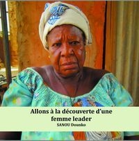 La photo d'une femme Africaine en robe verte. 