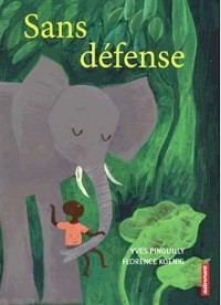 Dans la jungle, un éléphant porte un enfant sur sa trompe